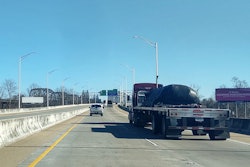 flatbed on highway bridge