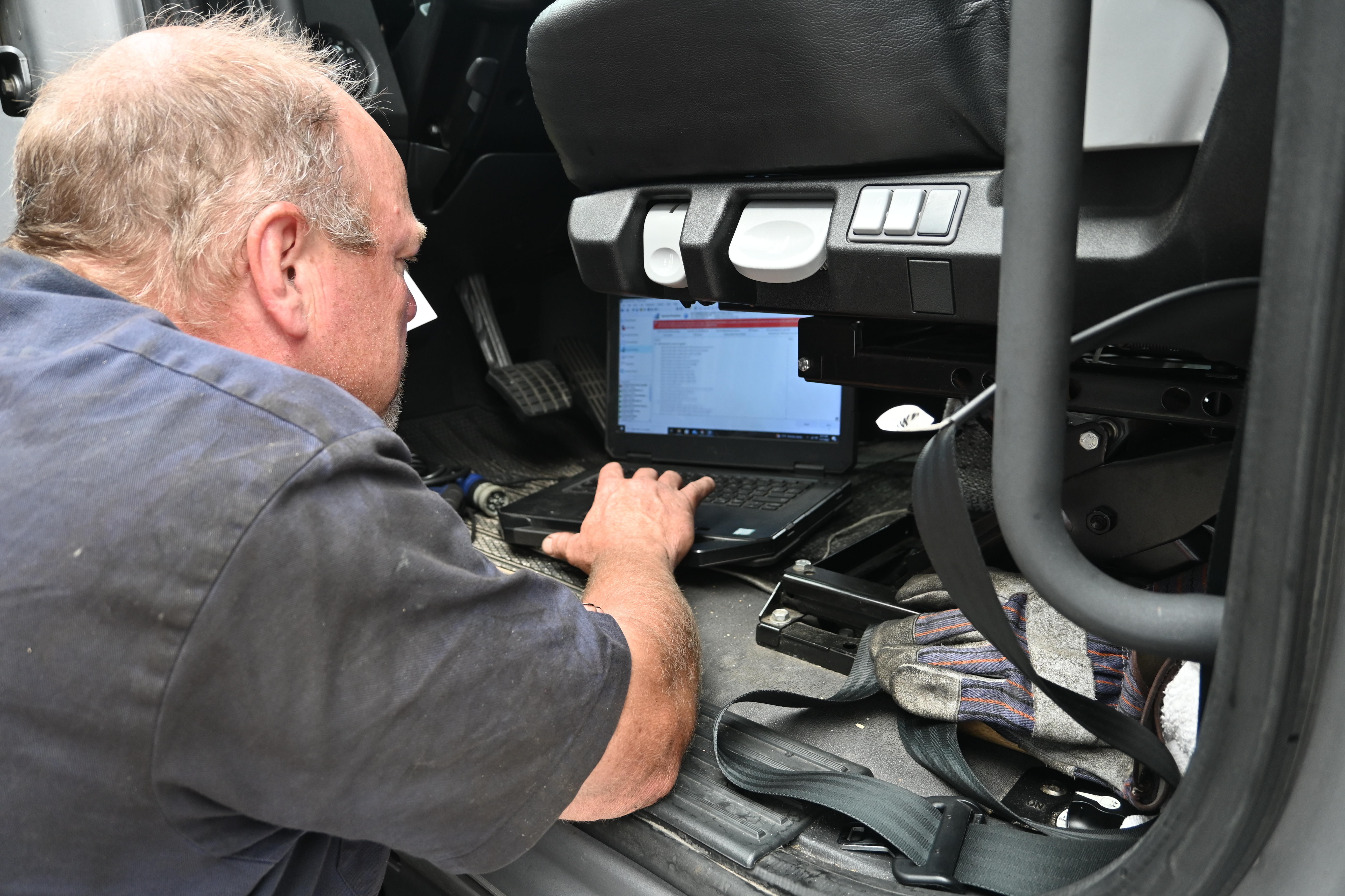 Diagnostic Maintenance Tech With Computer