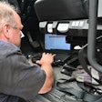Diagnostic Maintenance Tech With Computer