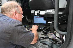 Diagnostic Maintenance Tech With Computer