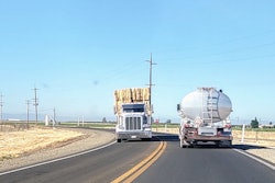 Tanker Hay Wagon On Highway
