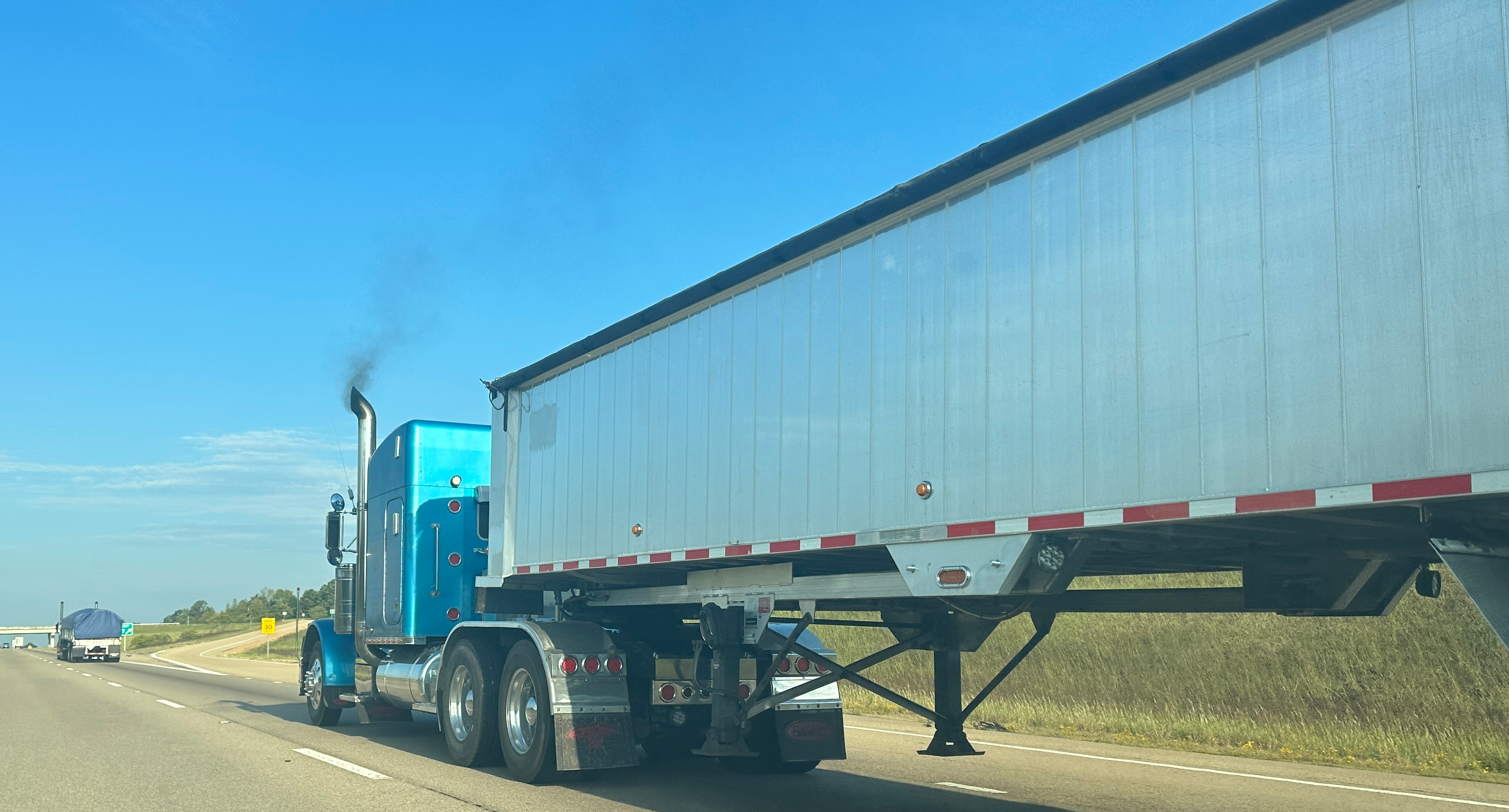 truck with exhaust on highway