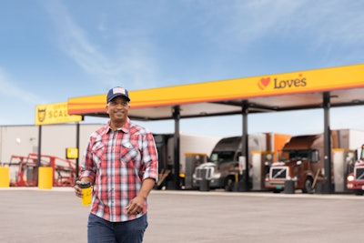 Love's fuel island, driver walking away