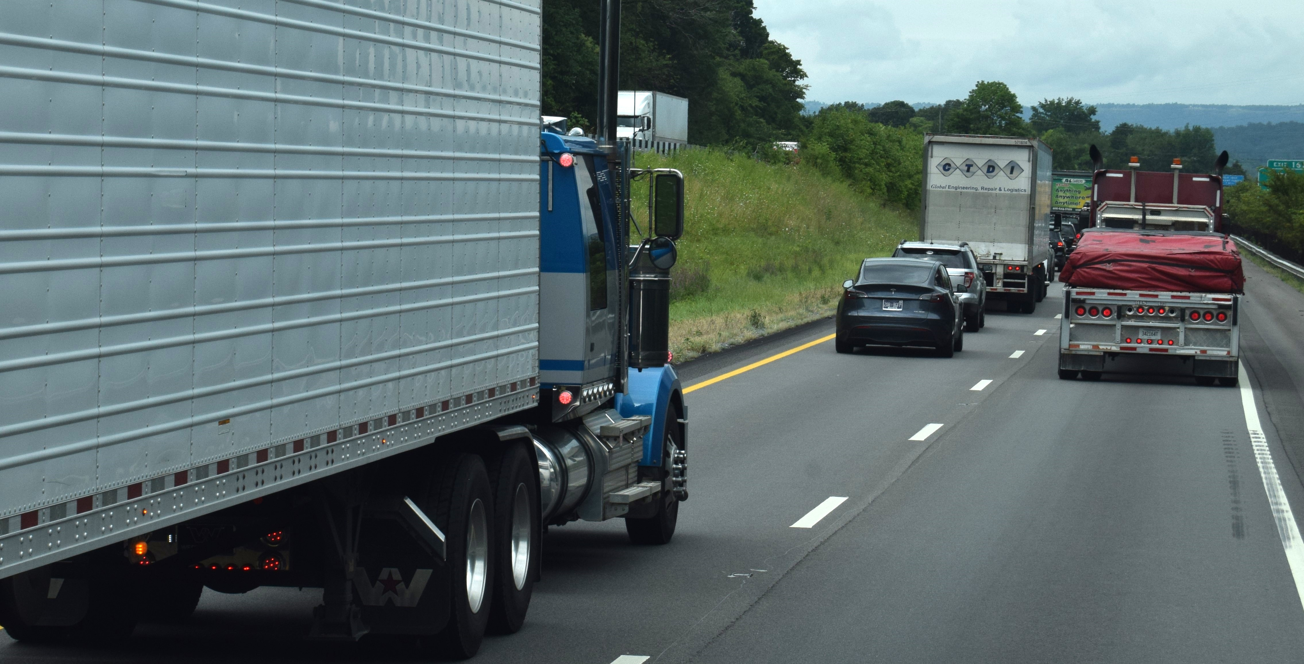 Trucks In Traffic Mountain Highway