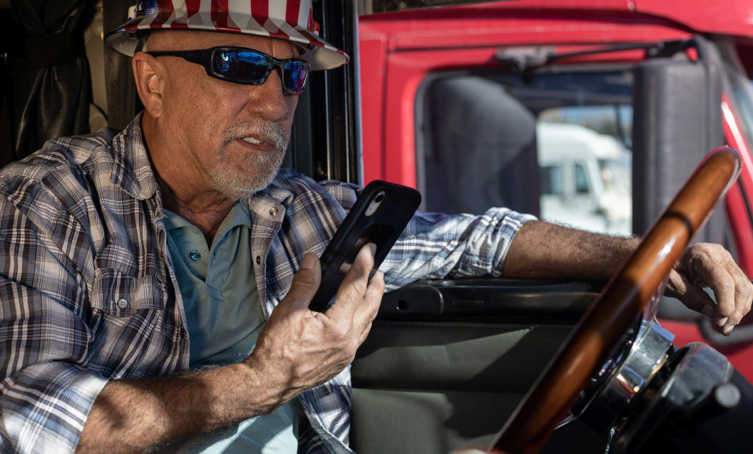 Driver Looking At Smartphone While Parked