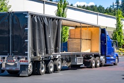 Conestoga flat loaded with pallets