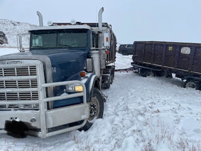 Freightliner pulling doulbe dumpers