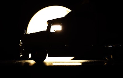 Teaser photo of scale model of Alan Kitzhaber's tractor, backlit
