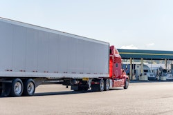 truck pulling around to fuel island