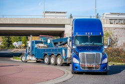 semi truck being towed