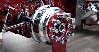 The bright brake drums stand out against the Legendary Red frame and custom stands on which the truck stood tall at the show.