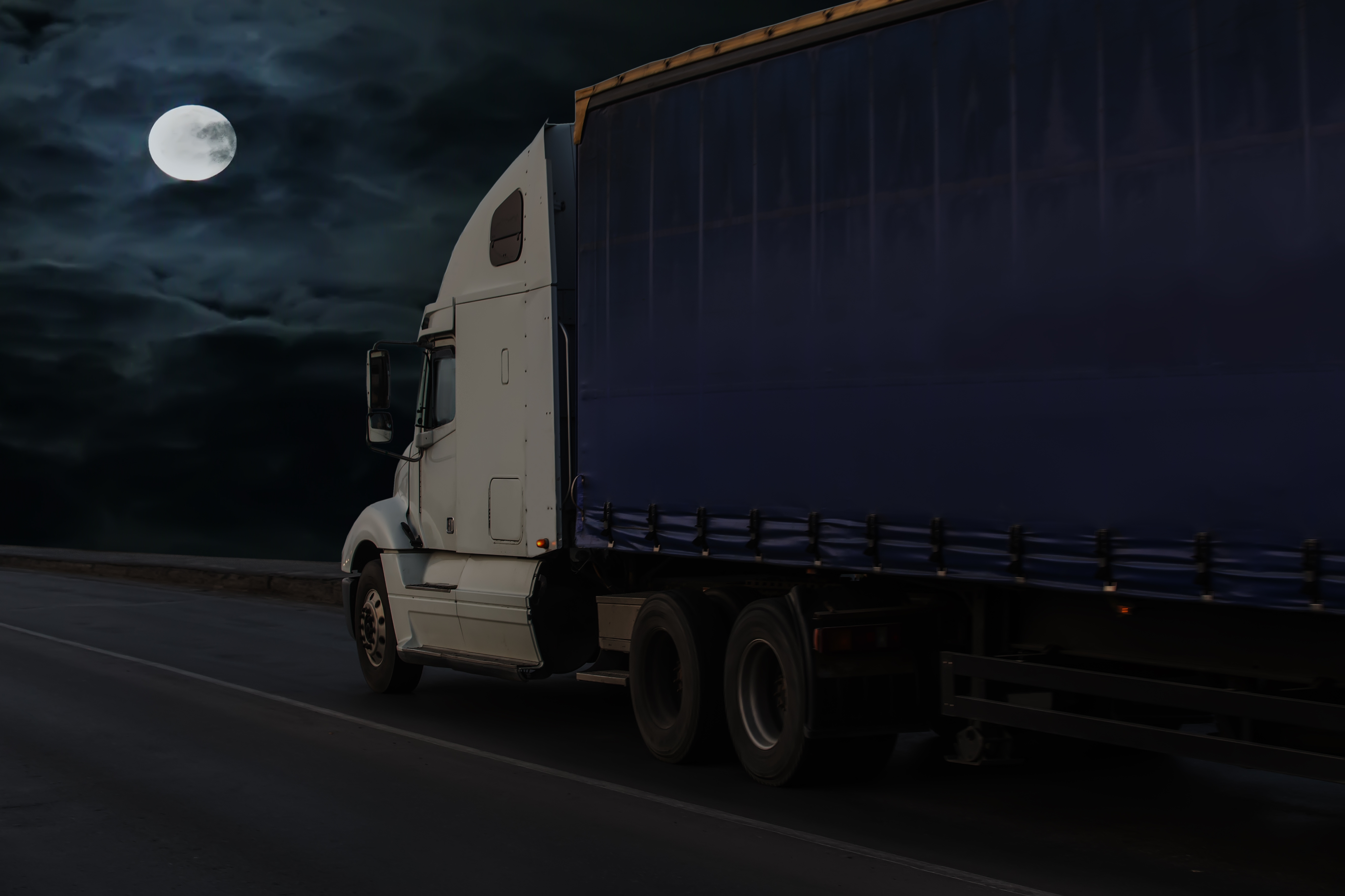 semi truck on highway at night