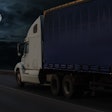 semi truck on highway at night