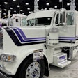 One of the 2025 Shell Rotella SuperRigs calendar trucks -- Hoewing Trucking's 'Purple Grain' 2023 Peterbilt 389 driven by Kevin Benson -- was on display at the Mid-America Trucking Show to promote the 2025 SuperRigs competition.
