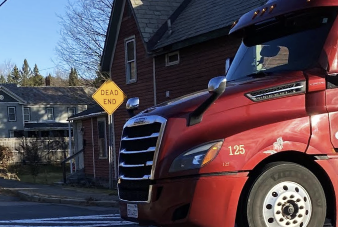 Red Truck Parked At Dead End Street