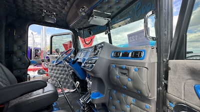 The dash and other interior parts are painted to match the rest of the truck and feature chrome and stainless accents. The interior lights are all watermelon LEDs.