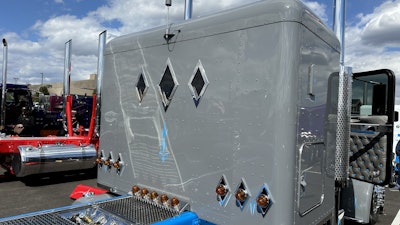 The rear of the truck features custom, CNC-machined aluminum pieces to go around the lights on the back of the cab to match the rear windows of the sleeper.