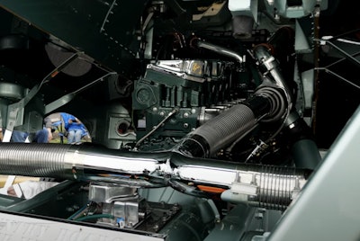 The engine is painted green to match the rest of the truck.