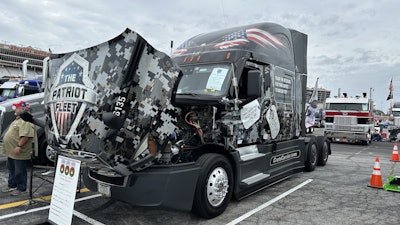 Crete Carrier Corporation driver Craig Daniels drives one of the company's Patriot Fleet trucks -- the 2022 Freightliner Cascadia shown here which he showed at the 2024 Stars, Stripes and White Lines truck show. The patriotic wrap on is impressive on its own, but Daniels -- a military veteran himself -- took it a step further and has had veterans he's encountered during his travels sign the truck and tell their stories.