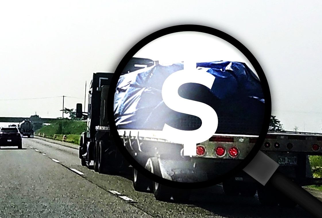 Flatbed On Highway Magnifying Glass