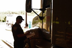 Inspector Talking To Driver