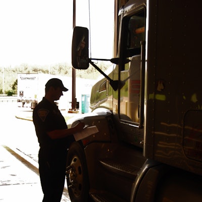 Inspector Talking To Driver