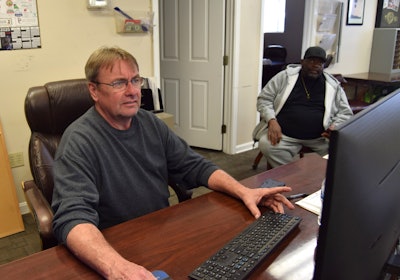 Wilson (left) and one among C.W. Express's operators are pictured after a big catered lunch offered to all the staff and drivers the day I visited headquarters.