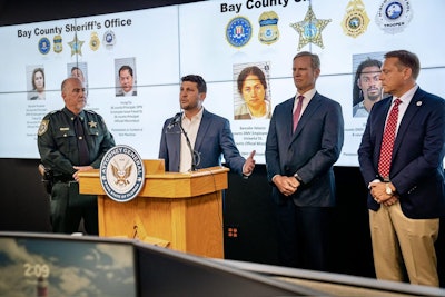 Florida Attorney General James Uthmeier (podium) and Bay County Sheriff Tom Ford (left) present the results of an investigation into a cash-for-credentials scheme in Florida.