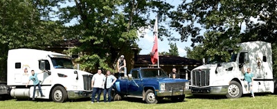 All in the family: Pictured are the two Sapphire Cartage 579s and Scott Smith's 1987 Chevy dually, likewise the entire family, who've been involved in the trucking business in various ways through the years. Tanner (14) is the youngest hanging off the left truck, DJ (15) in the bed of the pickup, Avery (20) behind the hood of the truck. Jasmine (17) stands with the rig on the right. All at various times rode along with Smith, and helped getting the recently acquired flatbed road-ready. The old DOT reflective marker on the 1995 model was 30 years old and showing its age, as it were. 'They got together with DJ on my big wire brush grinder,' Smith said, 'followed by Tanner with my wire brush in a drill, followed by Jasmine with alcohol and a rag and they stripped that old one off in no time. We put the new one on.' All have learned tarp folding, strap placement, corner protection, how to use chains and more. And while Smith doesn't 'expect them to go into trucking when they get older,' he's careful to talk them through any process new to them. 'Even something as simple as, 'I roll the straps up this way, with the hook facing this direction, so when I hook it and throw it, see how it unrolls,' letting them see firsthand how planning and prep can make the actual work easier. Hopefully that translates into other areas of life.'