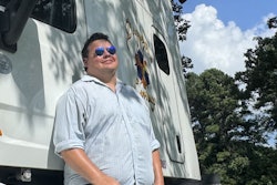 Owner-operator Scott Smith with one of his 2017 Peterbilt 579s at home in Searcy, Arkansas. His current hopper-bottom/flatbed trucking business builds on early oilfield experience and benefits from a close attention to detail when it comes to revenue and costs.