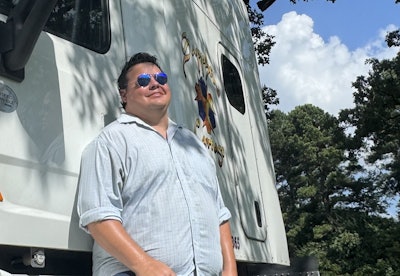 Owner-operator Scott Smith with one of his 2017 Peterbilt 579s at home in Searcy, Arkansas. His current hopper-bottom/flatbed trucking business builds on early oilfield experience and benefits from a close attention to detail when it comes to revenue and costs.