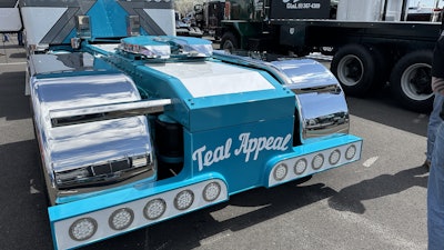 The truck's nickname is painted across the rear, coupled with custom light bars.