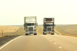 Two Trucks On Highway