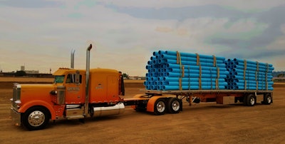 Kelsey's 1981 Peterbilt 359 is shown here loaded with PVC pipe -- freight he's hauled for the same customer for more than 30 years. The pipe's loaded on a 2012 Reitnouer flatbed that he bought new and still operates today.