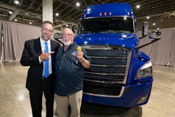 Landstar President and CEO Frank Lonegro presents the keys to a brand-new 2026 Freightliner Cascadia to Landstar All-Star Truck Giveaway Winner and new Landstar Million Mile Safe Driver George Eason.