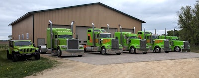 Hallahan Transport's company trucks are painted the company's signature custom green with Omaha orange accents.