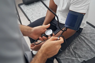 Medical professional measuring blood pressure