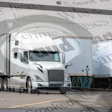 White semi-trucks parked at loading dock with warehouse background