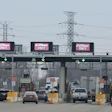 Toll plaza with multiple lanes and electronic EZ Pass signs