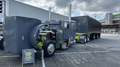 The truck's nickname, 'Bad Influence,' was bestowed upon the unit by its builders, A&A Stainless Steel. The 2013 389 is coupled with a 2025 Mac conestoga.