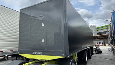 The 2025 Mac conestoga is painted to match the truck with the frame painted the same bright yellow.