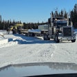 Here two of Muskie Creek's trucks stage for a rough trip over on Ice Road Truckers' triumphant return to TV.