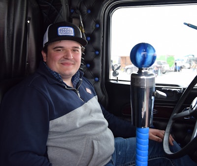 Spare Time Fab supplied the black-and-blue button tuck and other interior materials owner-operator Zach (pictured) had somewhat recently installed as of early May at Crossroads. Catch full detail of the interior work in the video up top.