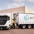 A Nikola Tre hydrogen fuel cell (FCEV) Class 8 semi being refueled by a HYLA mobile hub.