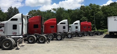 The fleet grew to base at a leased lot with an office and two-bay garage, 37 trucks, and 50 trailers split between dry vans and reefers.