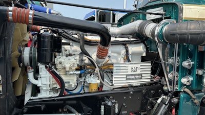 The truck was originally equipped with a Cat 3408 with a 5 and 4 transmission. It now boasts the Cat C18 with an 18-speed and 3.90 rears.