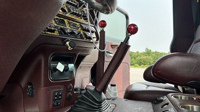 Between the seats, a full center console includes switches for the seat controls, cup holders and more. Red LED strips “light up the whole cab and everything,” Mendenhall added.