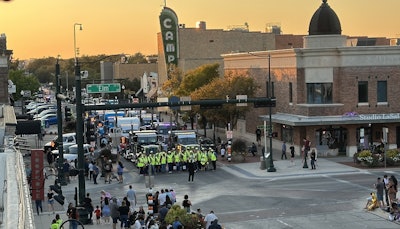 Volunteers raising funds for United Way of Denton County posed for a quick photo in front of the Peterbilt trucks staged in downtown Denton ahead of the 8th annual Peterbilt Pride & Class Parade.