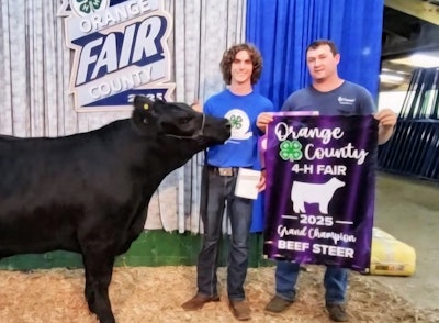 John Penn (right) and family in Indiana also own 20 head of cattle. 'It's plenty to take care of when you're a truck owner-operator,' Penn said. 'If it wasn't for my son,' also pictured, 'we couldn't do it.'