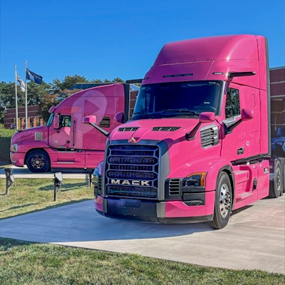 Mack Trucks' specially wrapped all-new Mack Pioneer (right) alongside the iconic “Pink Lady” Mack Anthem (left).